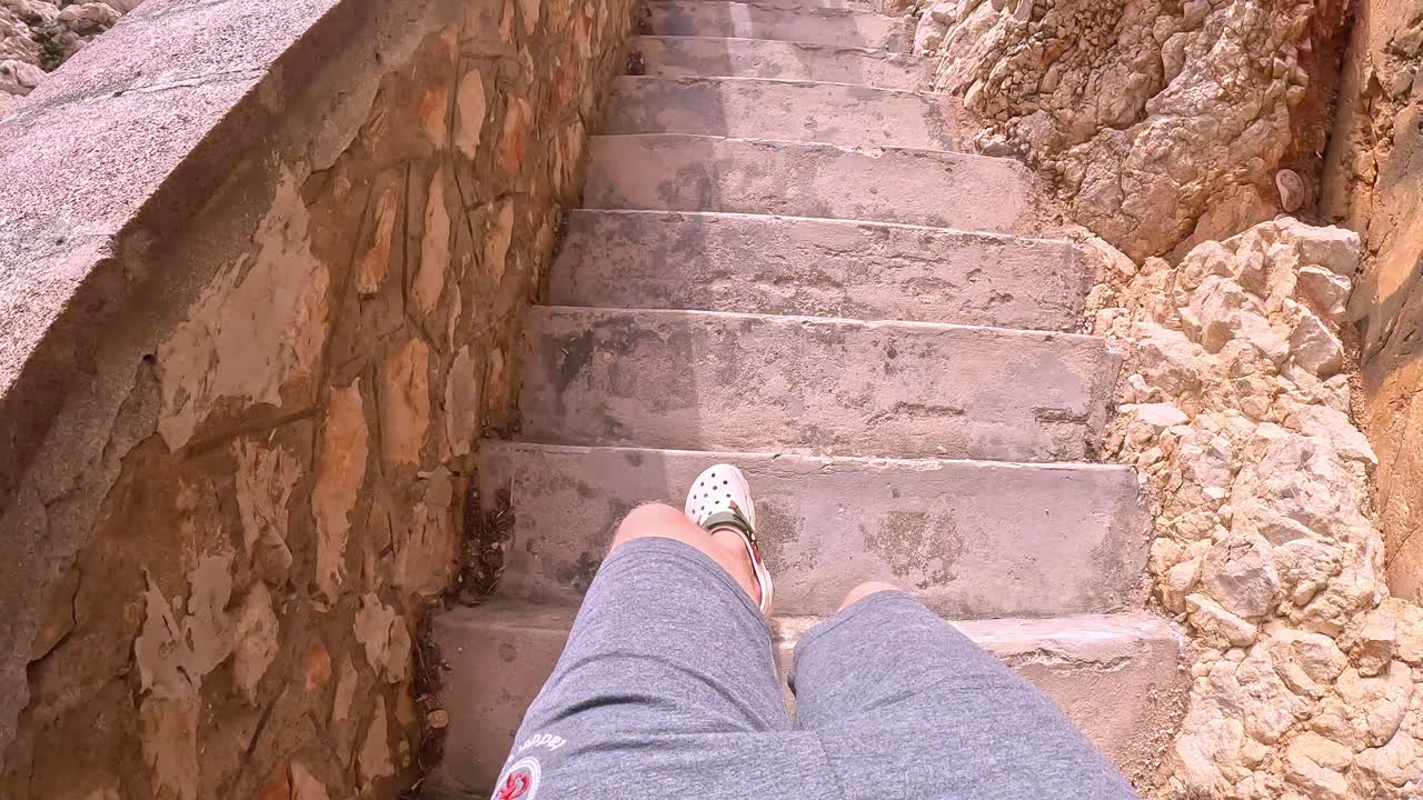 Girl Walks on Coastal Stairway in Sardinia, POV Reveal Seaside Pathway