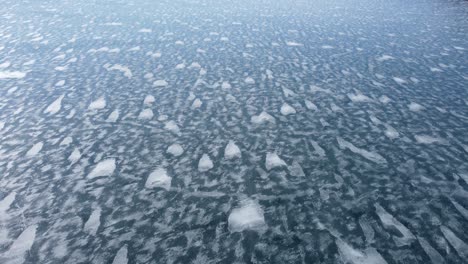 frozen canadian lake with unique bubbles in the crystal clear ice