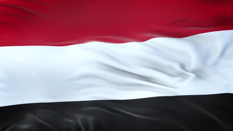 yemen flag waving in the wind with highly detailed fabric texture. seamless loop