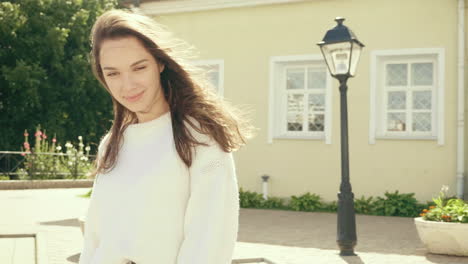 woman in a sweater in an outdoor setting