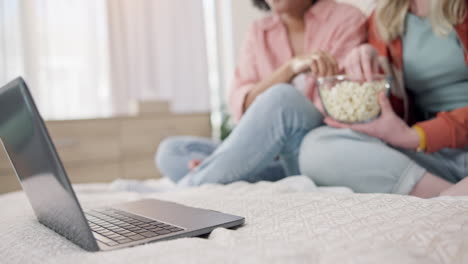 movie, laptop and women friends on a bed