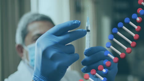 dna structure spinning against male senior doctor tapping on syringe to remove air bubbles