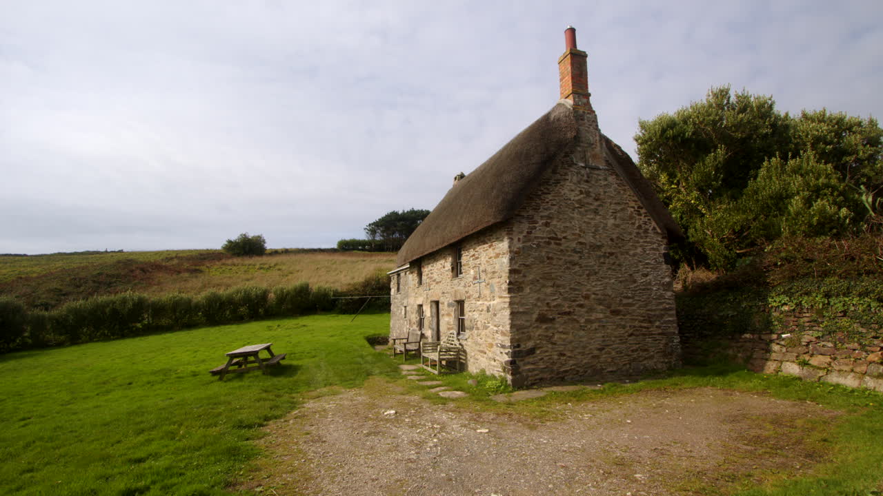 Extra wide shots of an old stone thatch cottage at Bessy's Cove, The Enys, cornwall