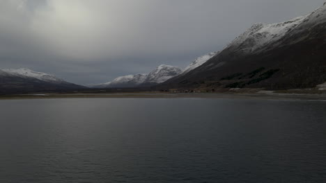 Fjord-Near-Breivikeidet-Fergekai-And-Mountains-With-Gloomy-Sky-In-Norway