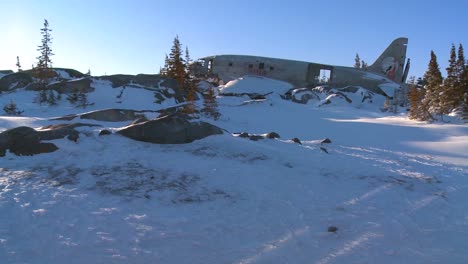 A-crashed-plane-sits-on-a-frozen-snowy-mountainside-in-the-Arctic-1