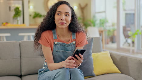 Phone,-thinking-and-young-woman-on-sofa-for-online