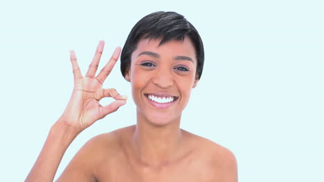 Woman-making-hand-sign