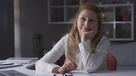 Elderly-businesswoman-working-in-home-office-unhappy-and-disappointed.