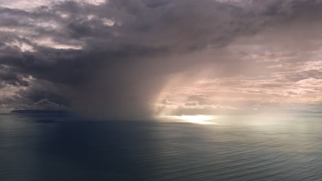 majestic sun rays piercing through dramatic clouds over the tranquil waters