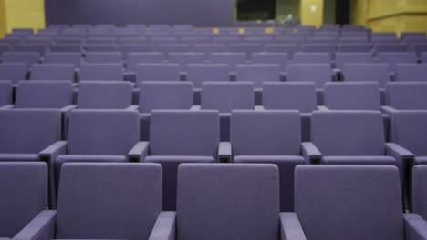 empty purple seats in an auditorium
