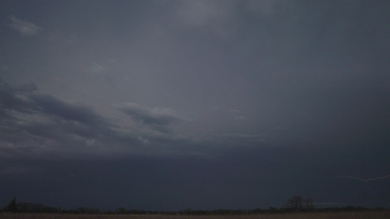 Overcast Sky With Lightning Strike Over Fields. Static Shot