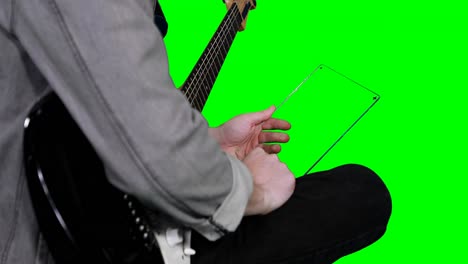 mid section of musician pretending to be using digital tablet