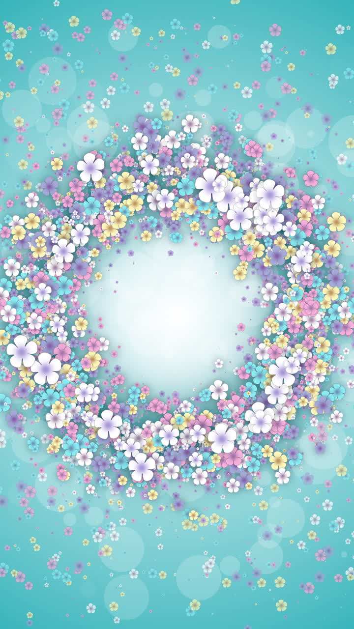 Floral round frame on a turquoise spring background. Small flying flowers with abstract particles. Looped holiday animation. Vertical video.