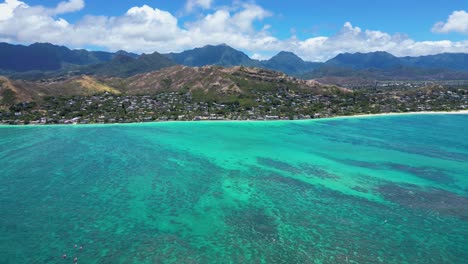 Drone-shot:-Kayakers-paddle-to-Lanikai,-Oahu,-HI