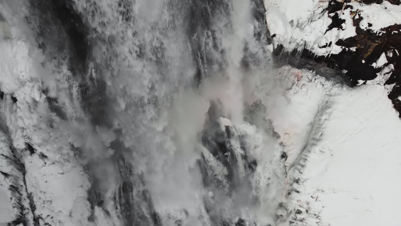 Alexander Falls, Frozen Waterfall In Whistler, British Columbia, Canada - close up, drone shot