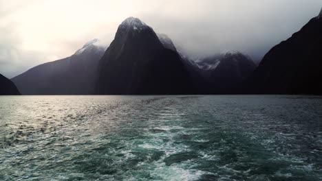 Boat-moving-away-from-Mount-Pembroke-on-cloudy-sunset