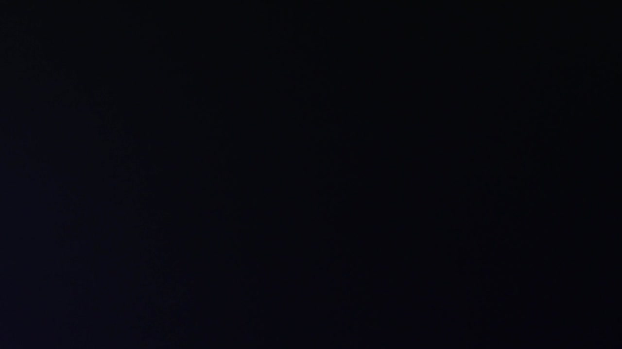 Floodlights shining brightly and turning on and off