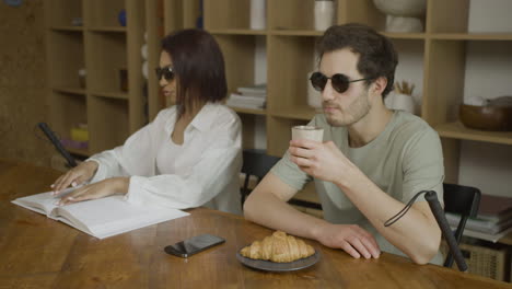 blind friends sitting at the table