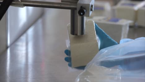 Milk pouring into the boiler at the cheese production plant