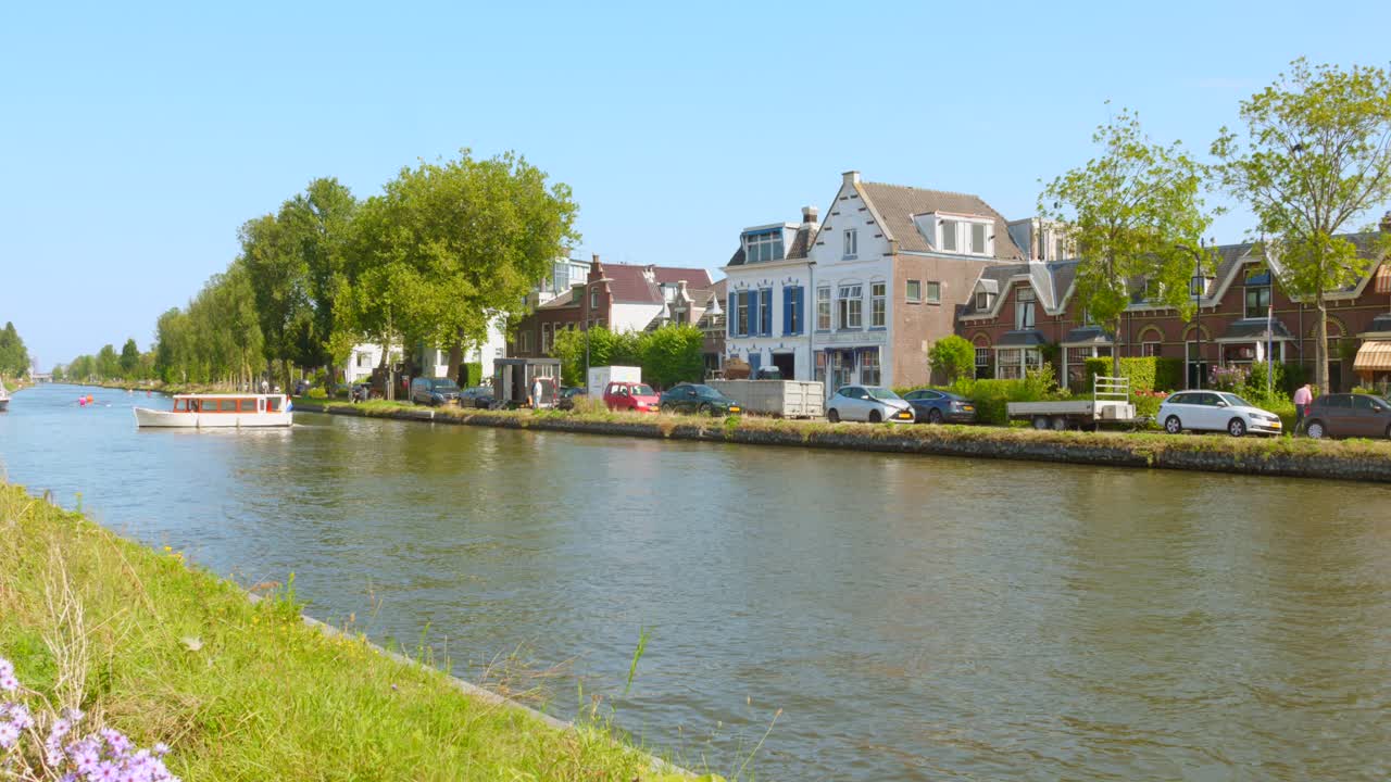 Traditional Canal And Houses At Delft Canal-ringed City In The Western Netherlands. Static Shot