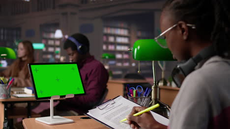 vertical video young female student studies for upcoming exams with copy space