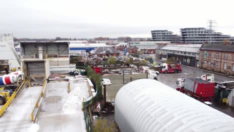 Industrial-CEMEX-concrete-manufacturing-factory-yard-aerial-view-with-trucks-parked-around-machinery