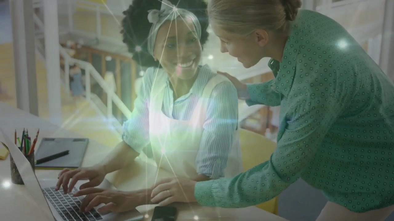 Seated woman typing laptop as mentor guiding keys to train, shifting network overlay in tech