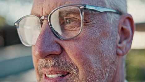 close-up portrait of an elderly man with glasses