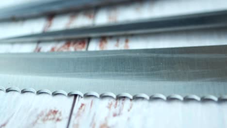 closeup of kitchen knives on a wooden table