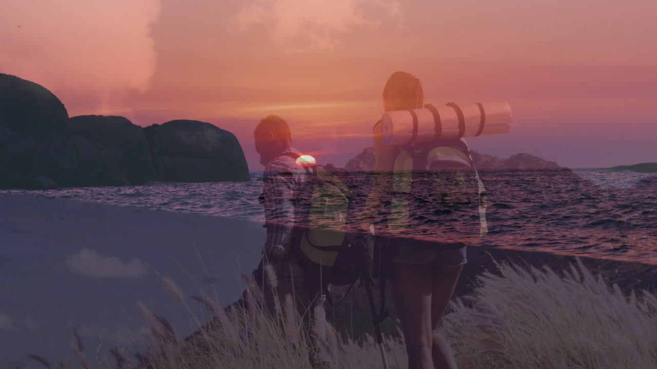 Couple hikers walking coastal trail at sunset, blending travel-themed ocean horizon overlays