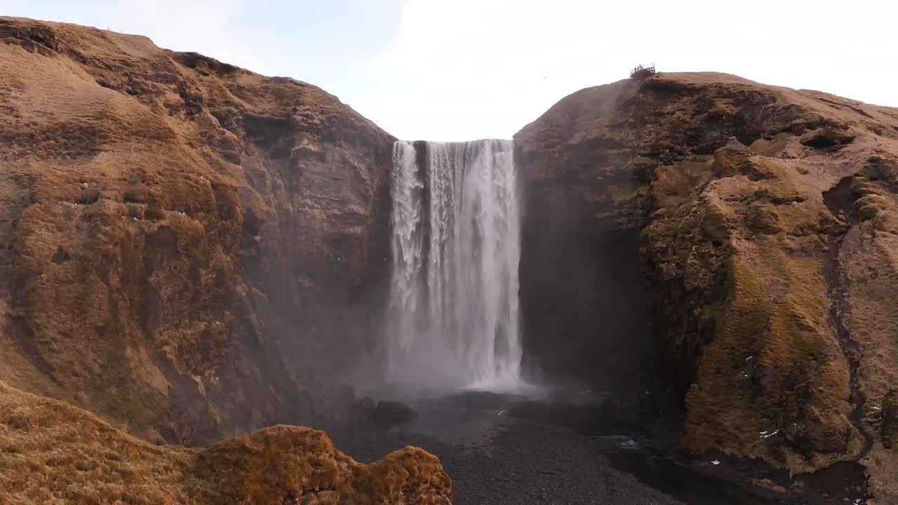 aerial - mighty Skógafoss falls through rugged heart of Iceland