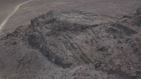 4k aerial drone shot next to desolate desert mountains