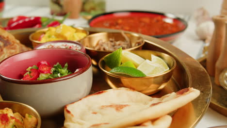 close-up view of a delicious spicy curry served in a colorful bowl with a spoon, ready for a tasty meal.