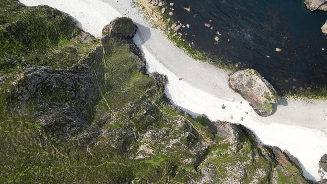 Over head view of Donegal sea stacks on a white shingle beach