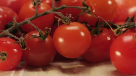 colorful organic tomatoes. mix tomatoes background, several varieties of sliced tomatoes top view. different assorted colorful tomatoes, heirloom, cherry, rose, beefsteak, cocktail, grape, purple.