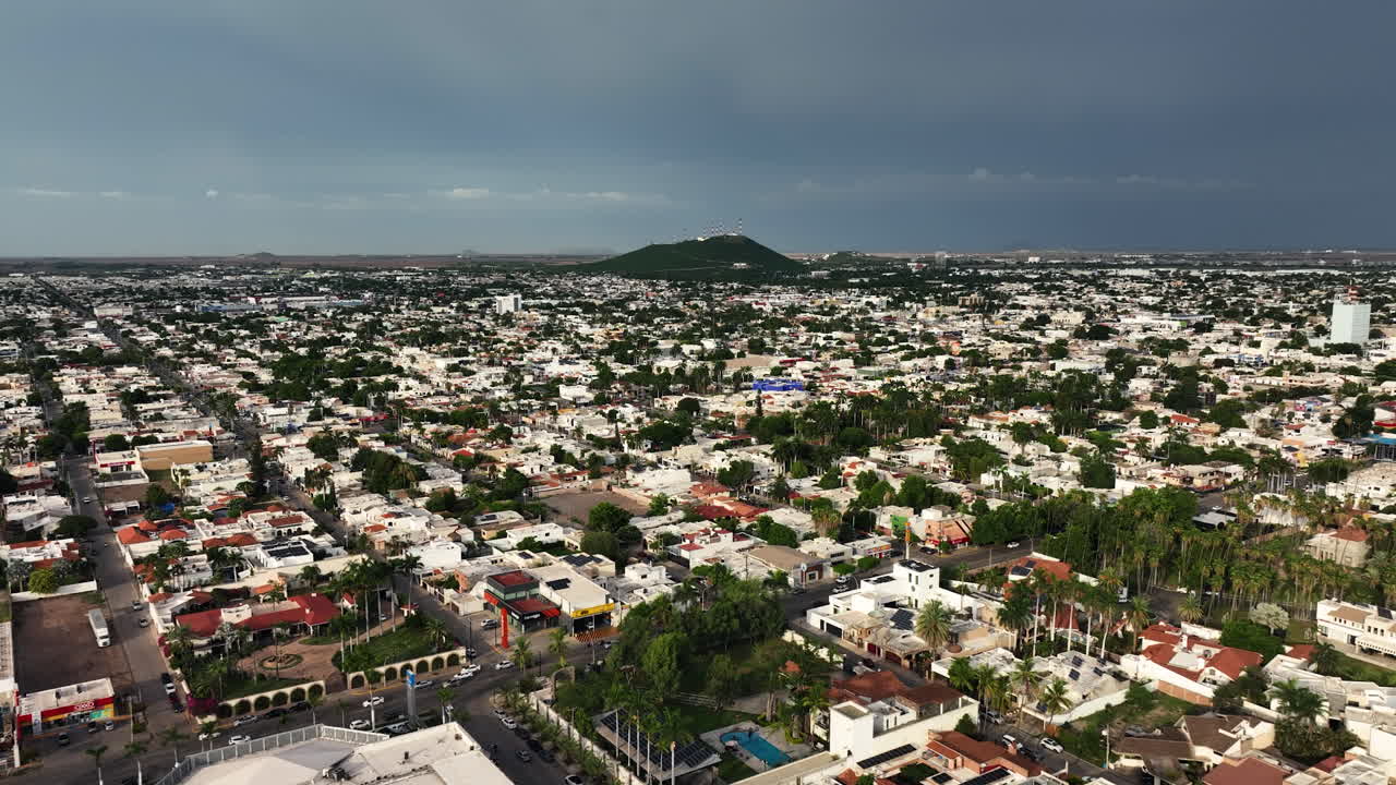 Aerial view diving over the cityscape of Los Mochis, in sunny Sinaloa, Mexico