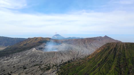 drone moves backward from bromo volcano to reveal the mountain java indonesia