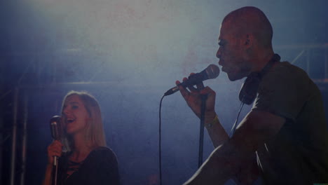 female singer and male rapper performing music on stage, with animated sound waves and chart icons