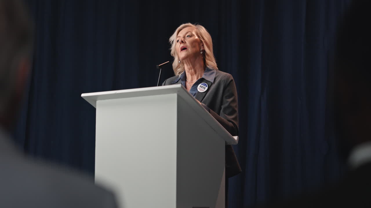 Woman Giving a Speech at a Podium