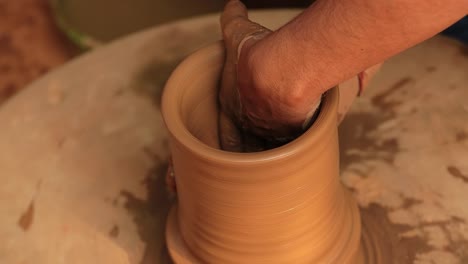 potter at work makes ceramic dishes. india, rajasthan.