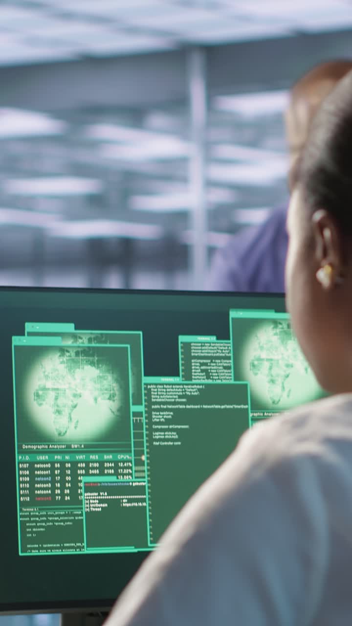 Vertical video Woman seeing critical error on PC screen in data center