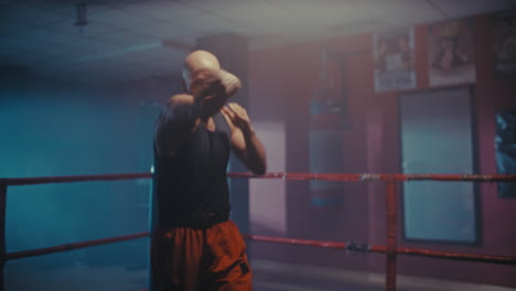 male boxer training in a boxing ring