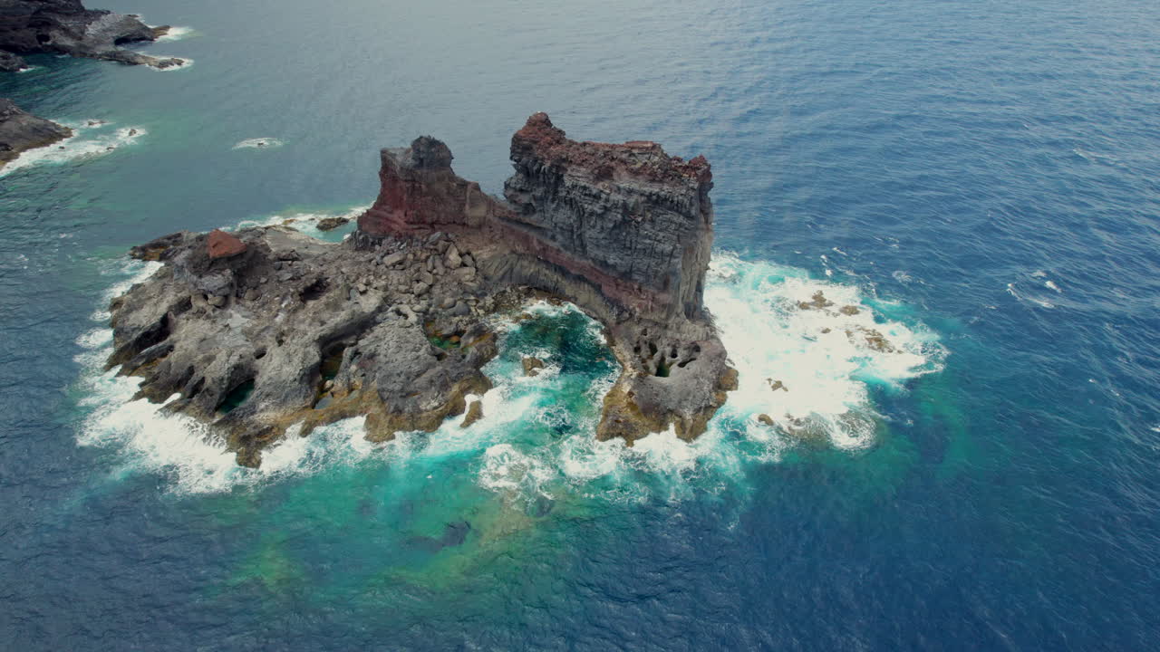 Aerial View of Volcanic Rock Formation in the Ocean