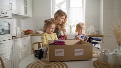 zoom in video of family sorting clothes for donation