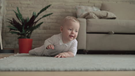 lovely eight months baby girl on the floor at home