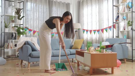 woman cleaning up after a party