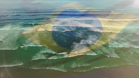 digital composition of waving brazil flag against aerial view of waves in the sea