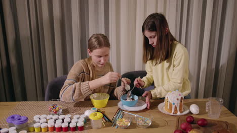 sisters decorating easter treats