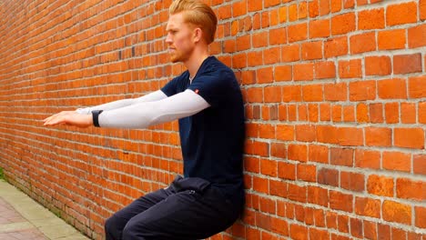 man exercising against the brick wall 4k 4k