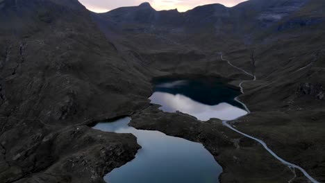 aerial flyover over lake bachalpsee in grindelwald first, switzerland with a view of faulhorn